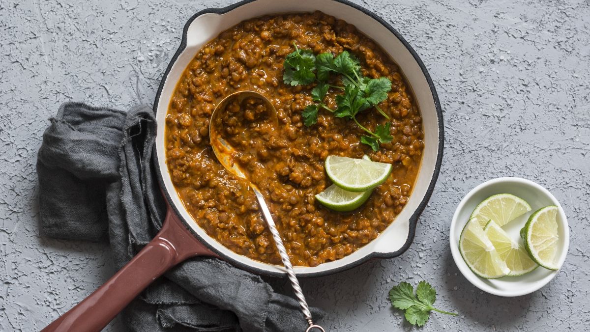 plant-based dinner - cream coconut lentil curry in a cast iron skillet