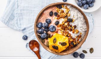 plant-based smoothie bowl recipe with chia seeds, berries, and granola