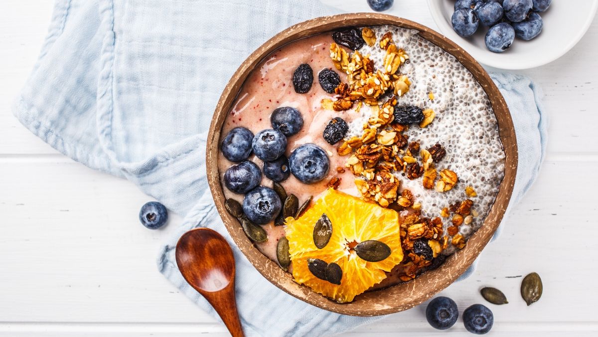 plant-based smoothie bowl recipe with chia seeds, berries, and granola