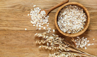 oats are healthy & support weight-loss, oats in a bowl, oat plant, brown background