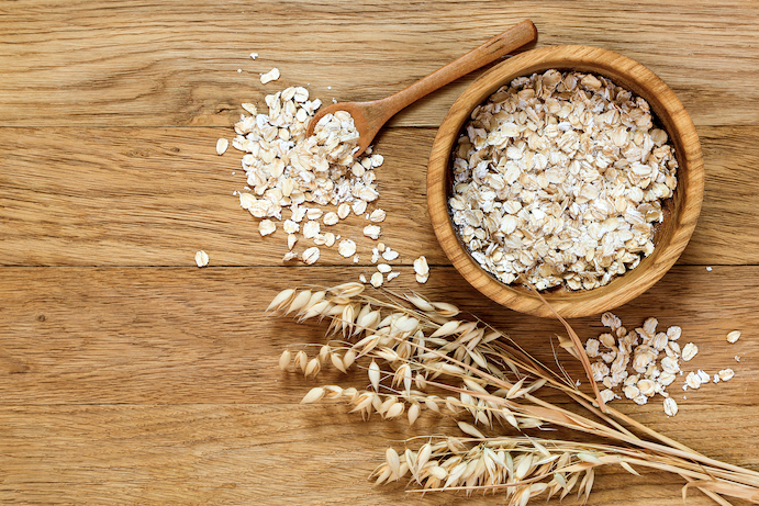 oats are healthy & support weight-loss, oats in a bowl, oat plant, brown background